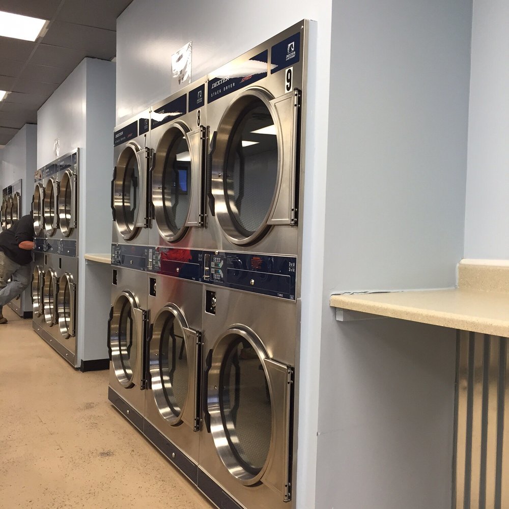 Commercial laundry room with washing machines and dryers for restaurants in Frederick